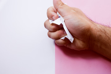 Man crumpling the piece of paper with hashtag: NOT AFRAID. do not be afraid of your desires.