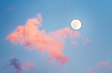 Dramatic night clouds and full moon