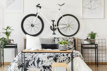 White bicycle in teenager's bedroom