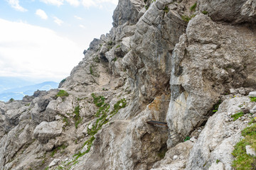 Iron stairs and hiking path to Ellmauer Halt at Wilder Kaiser mountains of Austria - close to Gruttenhuette, Going, Tyrol, Austria - Hiking in the Alps of Europe