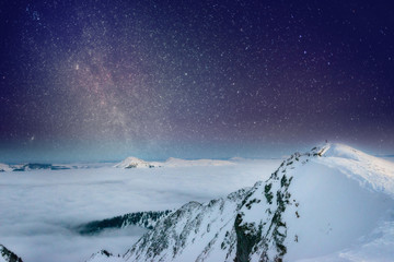 Night frame, Milky way star, Mountain range in the distance winter morning covered with clouds