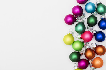 Festive Christmas baubles on a plain white background