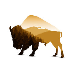 Silhouette of bison with autumn mountain panorama. © yik2007