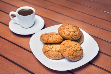 Coffee cup and cookie