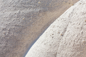 White waves of volcanic tuff closeup abstract background from Cappadocia, Turkey