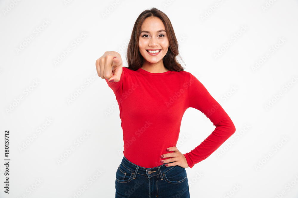 Canvas Prints portrait of a smiling asian woman pointing finger at camera