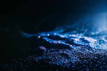 dark and blue abstract glitter background. Blizzard on cold planet surface concept