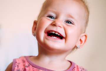 Portrait of playful cute little baby girl