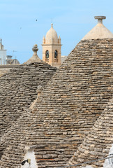 Fototapeta na wymiar Trulli houses roofs in Alberobello, Italy