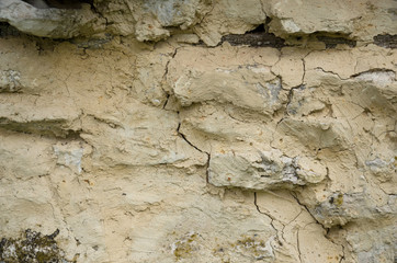Background of old stone wall with cracks.Rough texture.