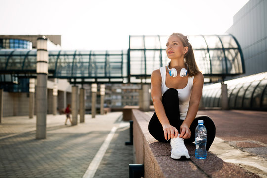 Picture of young attractive happy fitness woman