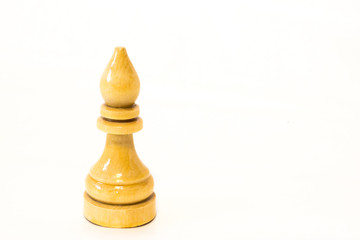 The white chess bishop of wood on the white background