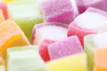 Colorful cube jelly candy isolated in white background