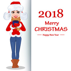 Pretty woman standing near a placard with greetings and holding a cup of hot drink.