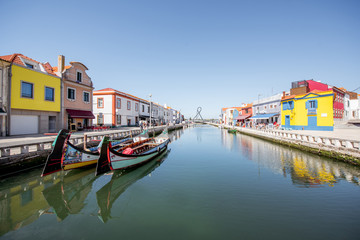 Fototapeta na wymiar View on the water channel with boats and colorful old buildings in Aveiro city in Portugal