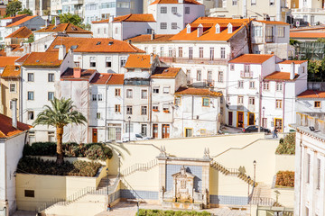 View on the beautiful white buildings on the hill in Coimbra city in the central Portugal