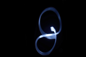 paint with light on black background number 8