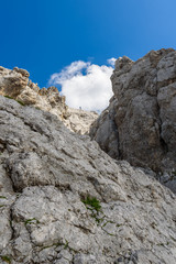 Hiker at Ellmauer Halt, Wilder Kaiser mountains of Austria - close to Gruttenhuette, Going, Tyrol, Austria - Hiking in the Alps of Europe