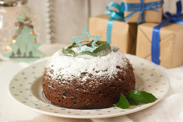 Christmas cake or pudding in festive decoration.