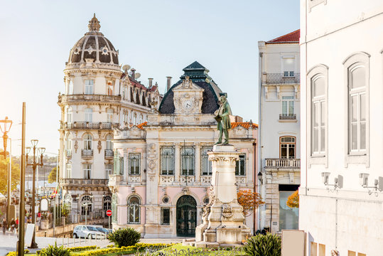 View on the beautiful square with Joaquim Augusto statue in Coimbra city during the sunset in the central Portugal
