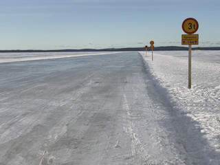 Ice road with traffic signs