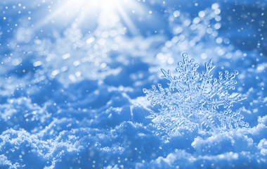 Christmas background with decorative snowflake on brilliant snow