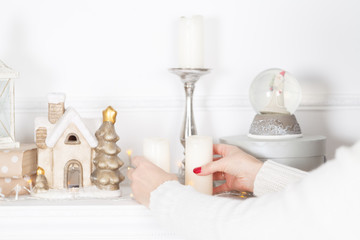 Traditional festive christmas decorated fireplace with candles