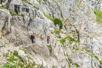 Hiker at Ellmauer Halt, Wilder Kaiser mountains of Austria - close to Gruttenhuette, Going, Tyrol, Austria - Hiking in the Alps of Europe