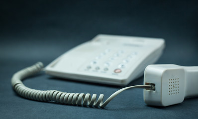 Office phone on a blue background.