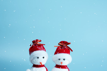 Snowman on blue sky background