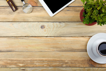 Office desk table with computer, pen and a cup of coffee, lot of things. Top view with copy space.