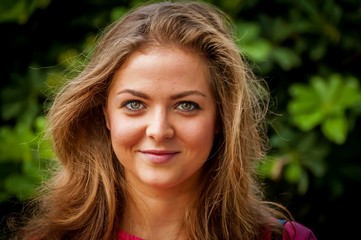 Fototapeta premium Young and attractive Caucasian girl with a mild smile, positive character, optimistic person.