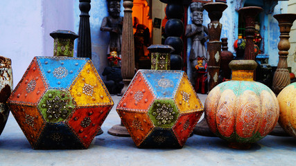 Old souvenir shop with many vintage items, wooden people or vase, for example. Jodhpur, Rajasthan,...