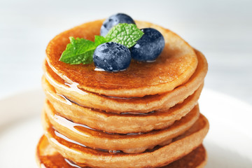 Tasty buckwheat pancakes with blueberries, closeup
