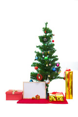 Decorated Christmas tree and gift boxes on white background