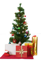 Decorated Christmas tree and gift boxes on white background