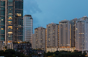 Close up of a modern high condominium with buildings