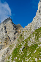 Hiker at Ellmauer Halt, Wilder Kaiser mountains of Austria - close to Gruttenhuette, Going, Tyrol, Austria - Hiking in the Alps of Europe