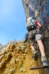 Hiker at Ellmauer Halt, Wilder Kaiser mountains of Austria - close to Gruttenhuette, Going, Tyrol, Austria - Hiking in the Alps of Europe