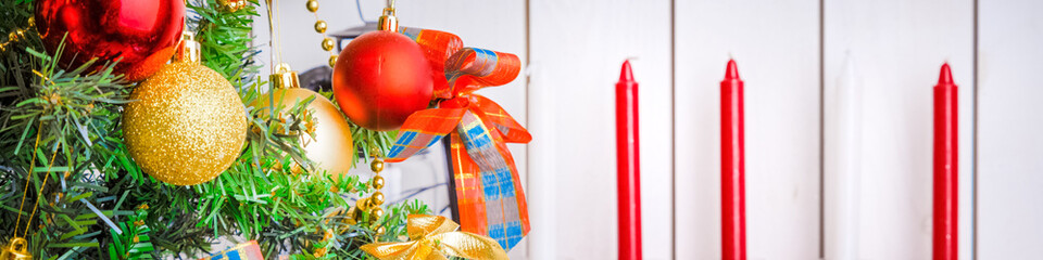 New Year and Christmas background, decoration with green fir tree, candles and Christmas toys,...