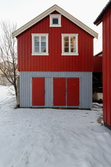 Facade of red-grey cottage-rorbu in A i Lofoten village-Sorvagen-Moskenesoya-Nordland-Norway. 0325