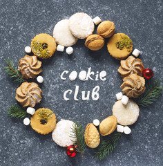 Christmas Cookies wreath. Assorted cookies: linzer cookies,shortbread, nuts cookie, orange almond cookie.