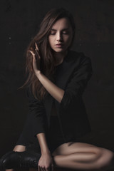 Fototapeta premium portrait young elegant woman in black jacket