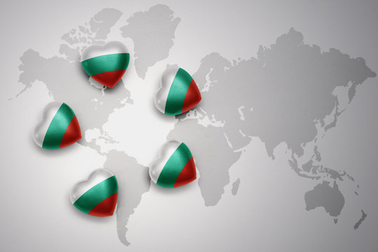 five hearts with national flag of bulgaria on a world map background.