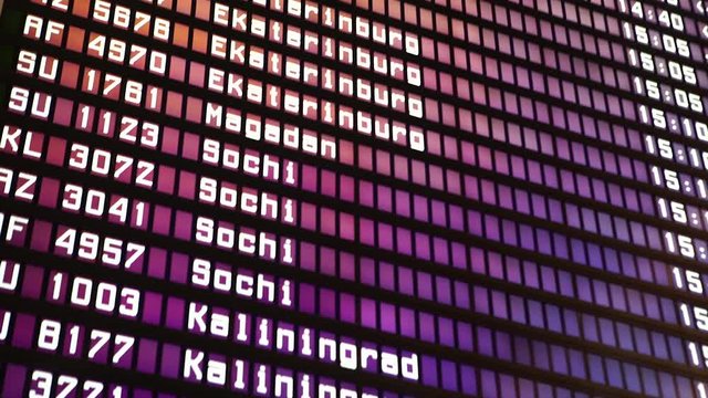 Departures board at the airport. Flight information electronically timetable. Split flap mechanical departures board. Flight schedule. Scoreboard flights