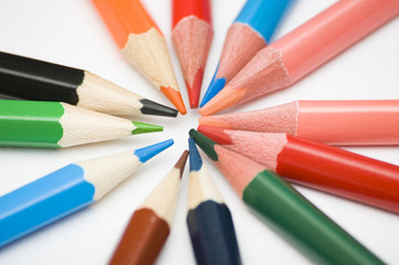 Naklejka premium many multicolored pencils on white background