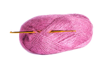 a ball of yarn and a hook on white background