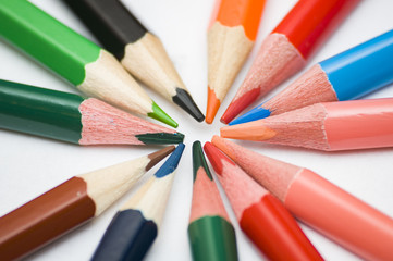 many multicolored pencils on white background