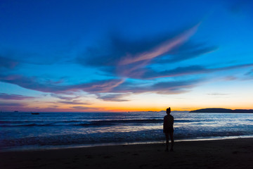 Silhouette Female Standing At Beach During Sunset