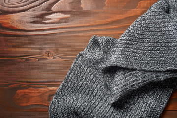 knitted sweater on old vintage wooden board